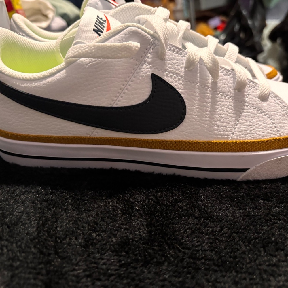 Nike White Low-Top Sneakers with Black Swoosh and Gold Accent - Picture 4 of 4